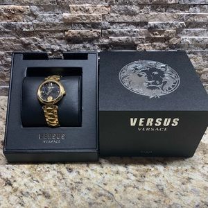 This is a Gold/ Black Versus Versace Watch